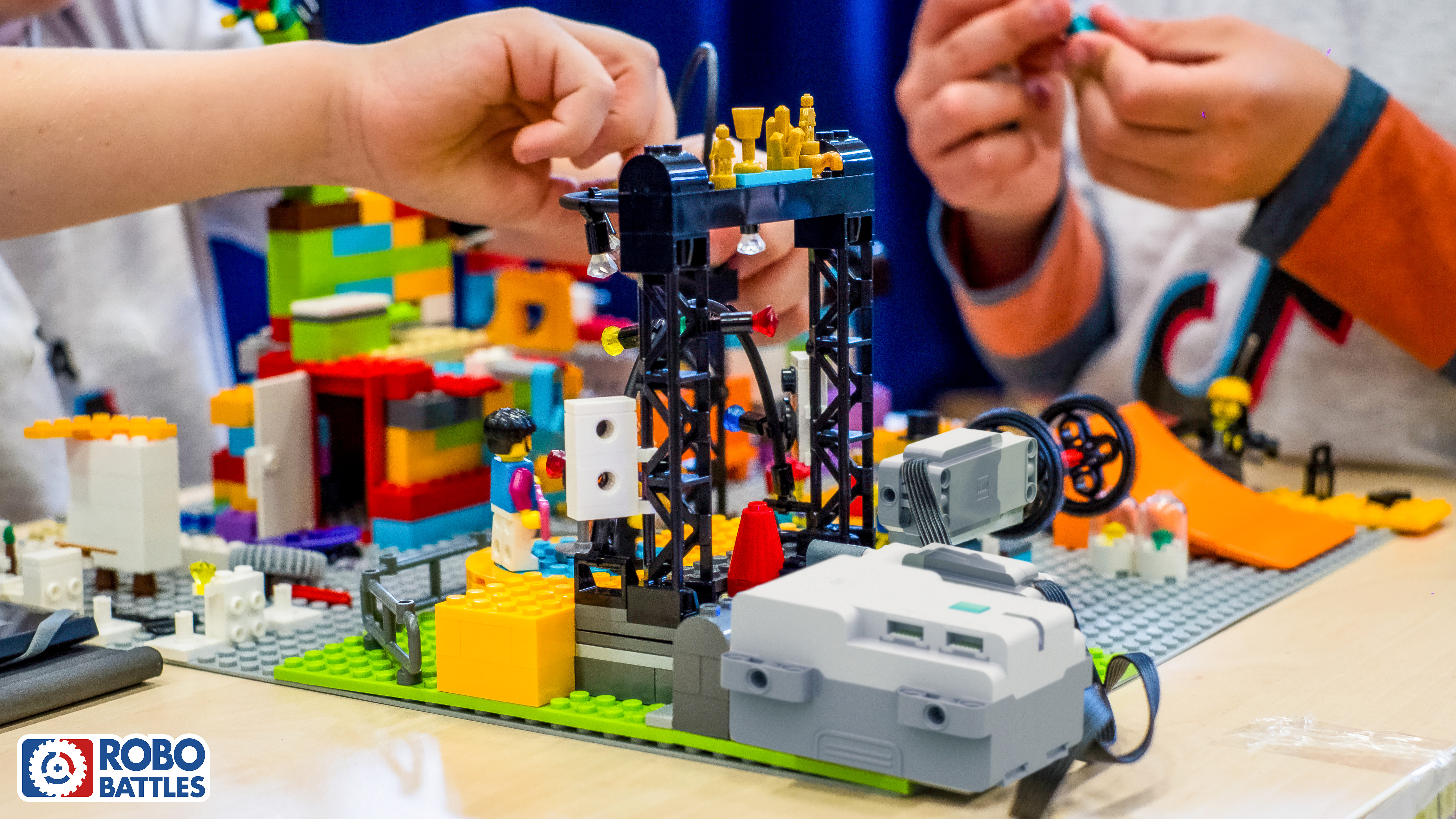 Children building LEGO battle bots