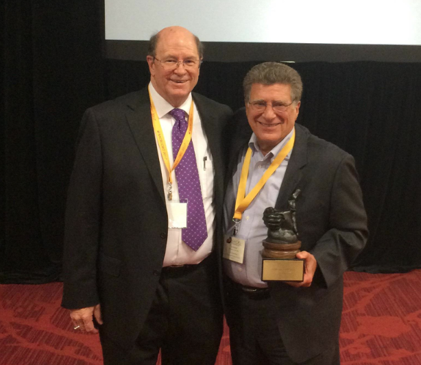 NACRJ Executive Director (left) with IIRP Founder Ted Wachtel holding the 2017 NACRJ Lifetime Achievement Award.