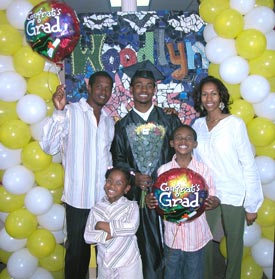 Ken, a jubilant graduate of CSF Buxmont, poses with his family.