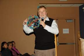 Bruce Schenk uses a Hoberman sphere to illustrate the benefit of helping offenders to feel apologetic instead of threatened, to learn from their actions and not only be punished for them. Photo by Ben Ingram
