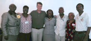 IIRP Trainer Lee Rush during a Training of Trainers in Jamaica. Slain peace worker Mohan Bunwarrie is second from Rush's left.